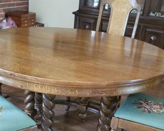 View of stunning dining room table, comes with 2 leaves and chairs