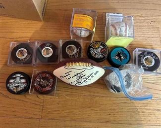 Some of the signed hockey pucks