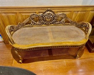 very unusual caned seat bench with carved frame