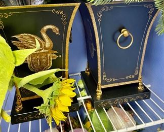 we have two of these black and gold toleware vases with swans, by Jeanne Reed, Williamsburg VA.