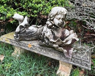 Garden statue on bench