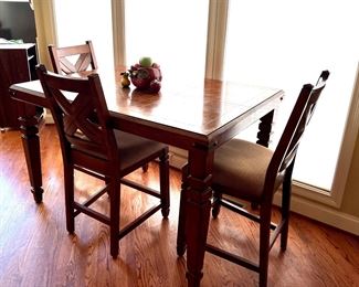 Tall kitchen table with 3 of 6 chairs