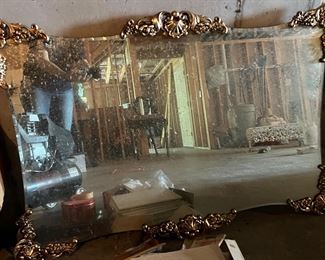 Large antique mirror with gold florets 
