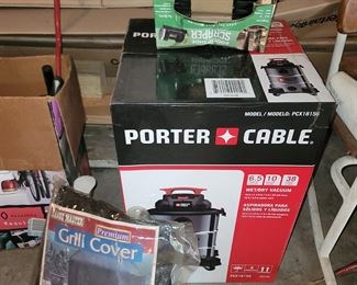 New Porter Cable Wet/Dry vac in box. Grill cover. Boot scraper