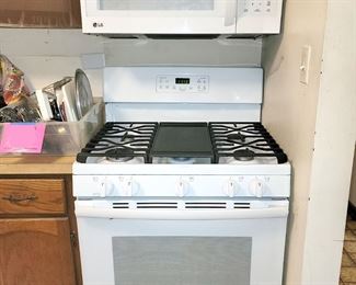 LG over the range microwave oven. GE gas stove with lower broiler