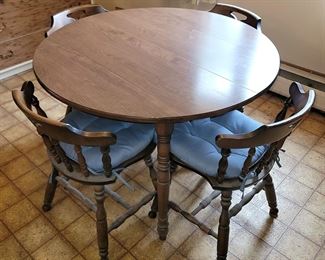 Round kitchen table with four chairs
