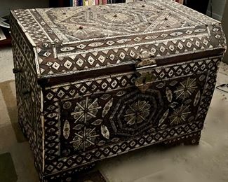 Bone inlaid trunk with coral insets