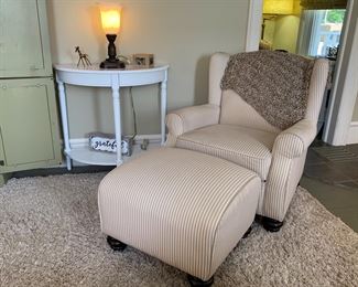 Elegant arm chair and matching ottoman, half moon table, lamp