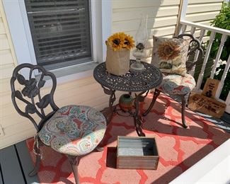 Cute cafe patio porch table and chairs, oil lamp, rug