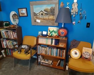 Middle bedroom, more books and yellow chairs