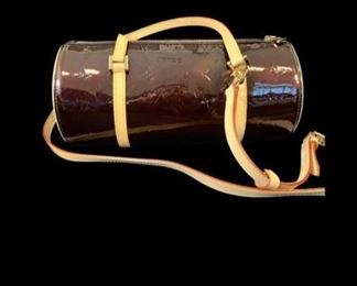 Handbags from Chanel, Louis Vuitton, Jimmy Choo, Ferragamo, Prada, and others are represented in this collection.  Above is a Louis Vuitton "Papillion" monogram barrel bag in mirror vinyl in excellent condition