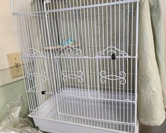 Hanging Bird Cage  and an assortment of items to care for your bird.