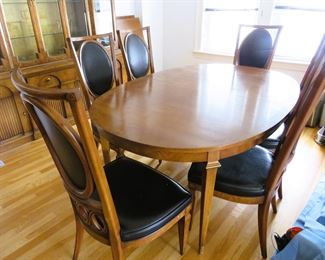 Mid-century modern dining room table with chairs and leaves