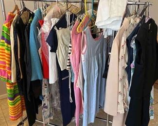 Large group of vintage clothing, jackets, and furs