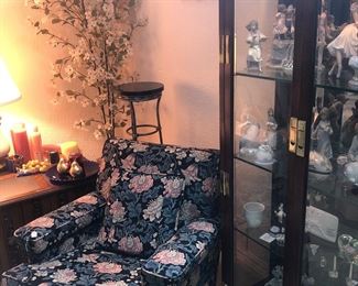 Upholstered swivel rocker and curio cabinet