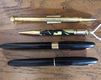 Gold filled mechanical pencils, and Sheaffer fountain pens.  One is a white dot