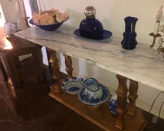 Marble top  table and some of the many pieces of cobalt blue glass and blue and white china.  Mid century light metal and porcelain made to sit on table or hang