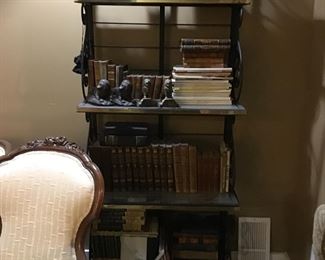2 Iron and brass backers racks, and leather bound books