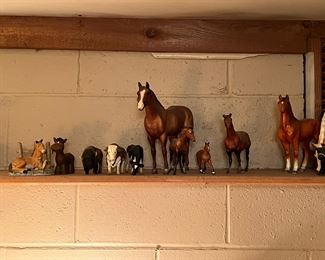 Breyer horses, ceramic foal statue, and other animals