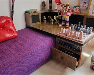 Matching daybeds with stereo and speakers connected. 