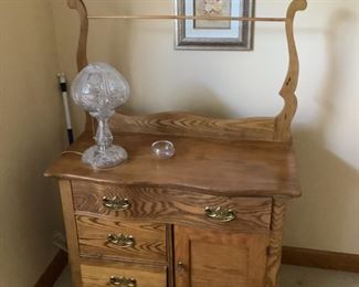 Antique oak washstand with towel bar…measures 34” w x 18” d x 29” t …..50” t with towel bar.  $125