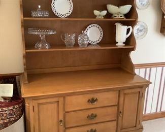 China hutch (top can be removed) measures 48” w x 79” h x 21” d.  Has four drawers and cabinets. Presale $175.