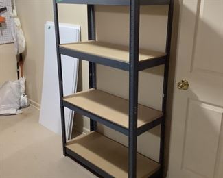 Steel shelving unit with press board shelves measures 60” h x 16” d x 36” w