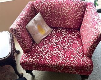 pair of red upholstered chairs 