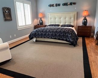 Beds, rugs, night stands, lamps, chairs, art