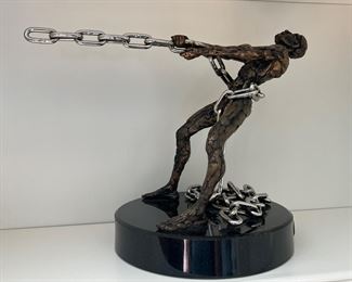 Superb bronze sculpture, depicting man pulling chromed chain, Artist Signed