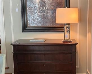 Chests of drawers, decorative lamps and artwork