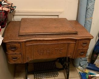 #52 White treadle sewing machine in oak case $125.00