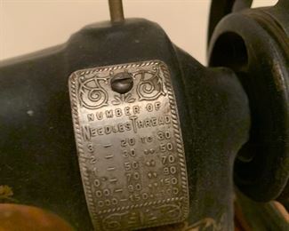 #52 White treadle sewing machine in oak case $125.00