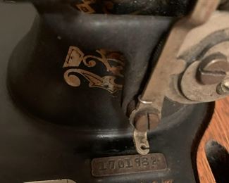 #52 White tredle sewing machine in oak case $125.00