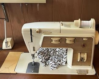 sewing machine in cabinet