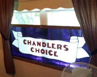 Large stained glass window,  a retail store sign