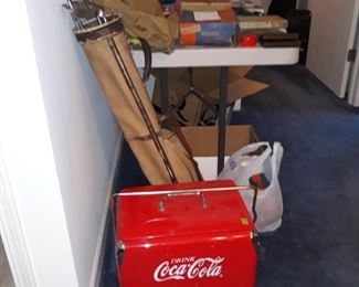 Coca cola cooler
And
Vintage golf club bag with irons
