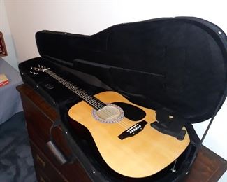 Six string guitar with case and tuner