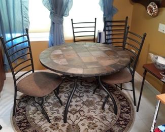 45 inch diameter  round table with four nice size chairs
Round rug 
