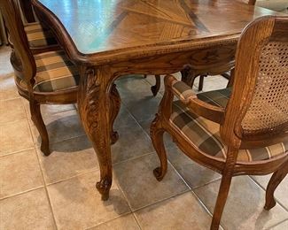 $295. OAK Dining room table with 6 chairs.  Parquet top.  Table, chair upholstery, and wicker caning all in Excellent Condition.  