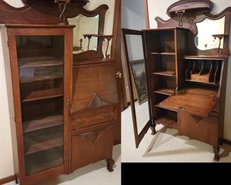Secretary [Just another name for a desk!] Antique oak Secretary. Restored/Refinished and excellent condition. Very compelling for a private desk and includes 5 shelves in glass door, a storage drawer under the desk area and an additional storage area under the drawer. 