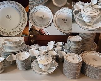 Noritake China – Glendon 5423 Pattern. Cir: 1950s VINTAGE 
Excellently cared for and well maintained, this luxury set of dinner ware includes 198 pieces represented by 29 dinner plates, 26 salad plates, 25 bread plates, 36 cups, 35 saucers, 3 serving plates, 5 serving bowls, 17 fruit bowls, 14 soup bowls, 2 gravy boats, 2 sugar and creamers, and a tea/coffee pot with lid. Impress your closest 24 friends & relatives with a gorgeous tablescape. Literally only one plate with a slight chip. 
