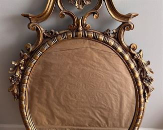Gold oval mirror