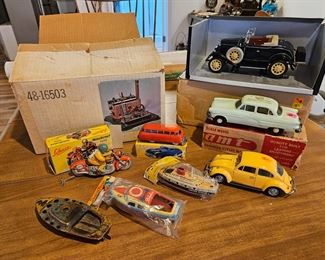 
$ 75  Schuco Bus 1004
$10 ea Dolphin  and cruise boat in package
$6 No. B Pon Pon tin boat. 
 SOLD-Jenson Steam engine
, Schuco Mirakomot 1012 Motorcycle, mint condition,  box in great condition, except for one flap is ripped off at the end but it is there.