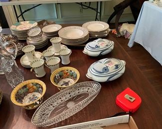 The amount of china, crystal and porcelain is amazing! Beautiful dining room table.