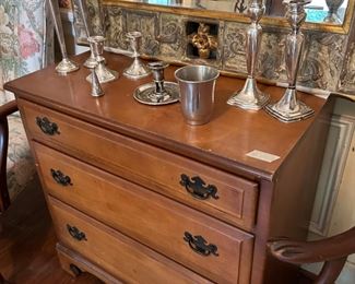 A great sized chest with sterling candle sticks.