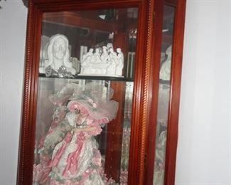 DISPLAY CABINET, OLD DOLL AND RELIGIOUS STATUES