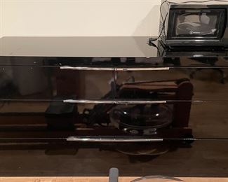 Mid-Century Black Lacquer Bureau With Chrome Drawer Pulls. Has Chip on Top Edge. Measures 65" W x 20" D x 35" H.