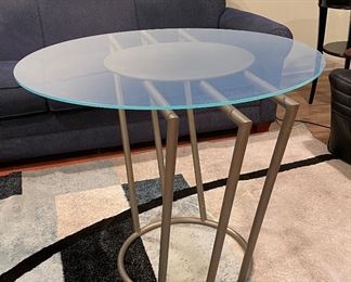 Modern Brushed Metal Occasional Table With Glass Topper. Measures 44" W x 30" H. Photo 1 of 2.