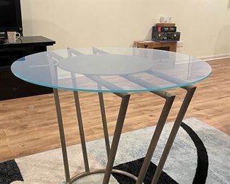 Modern Brushed Metal Occasional Table With Glass Topper. Measures 44" W x 30" H. Photo 2 of 2.